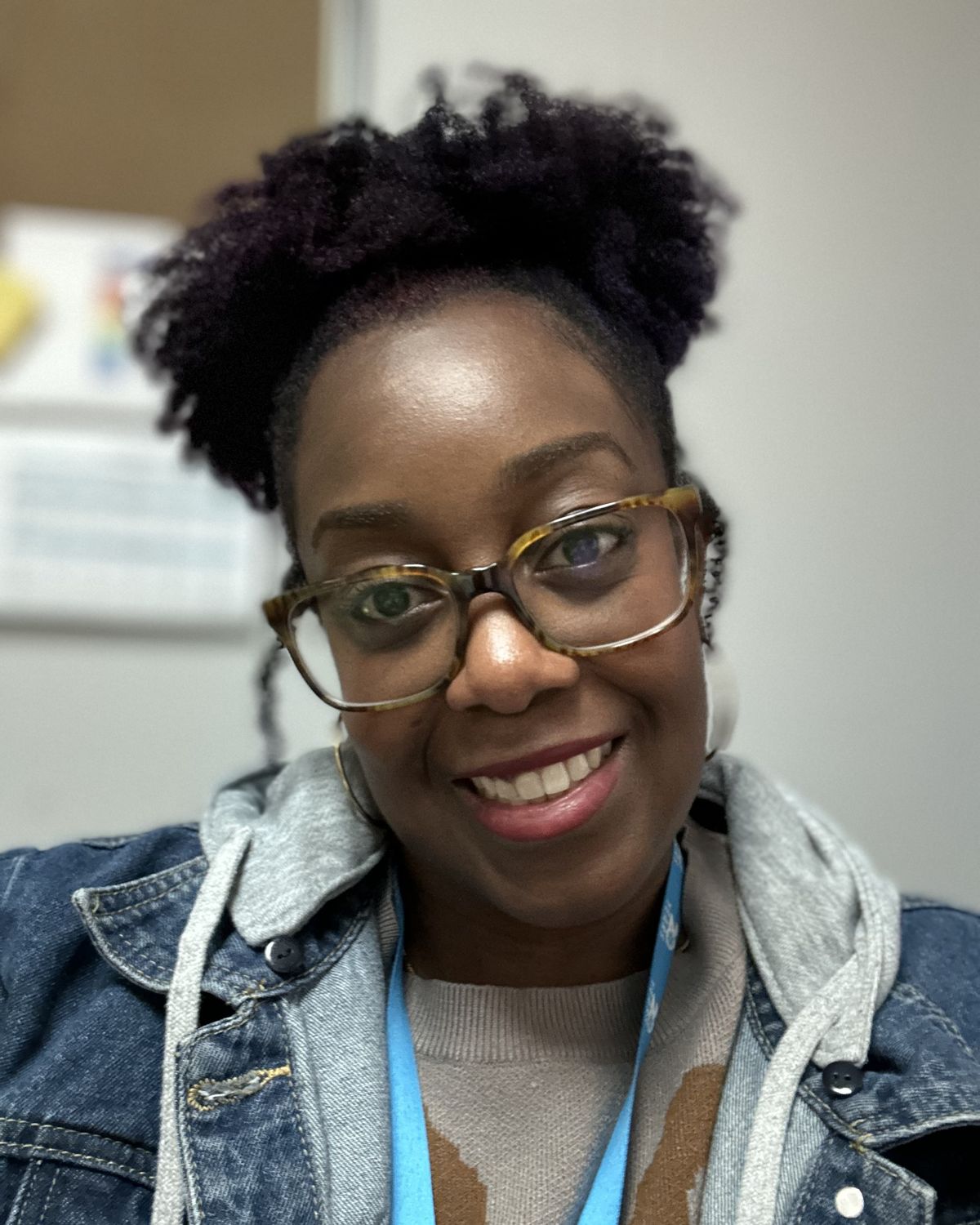 Dr. Keri, warm and open, looking straight at the camera.